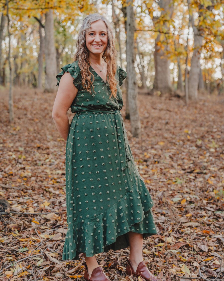 Rachel, full-length portrait outdoors among the autumn trees